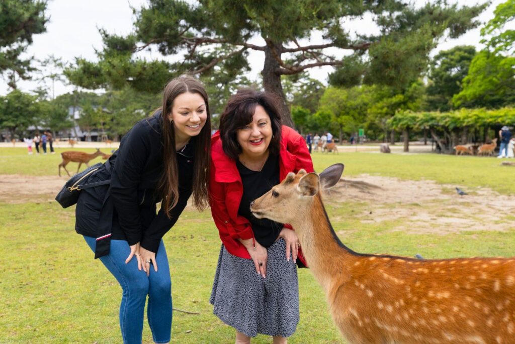 Krysti and Mom Nara Krysti and her mom posing next to a deer in Nara, Japan.