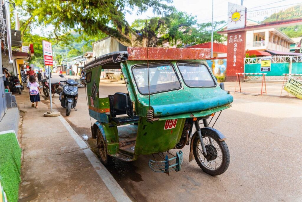 Coron Tricycle A traditional green Filipino tricycle parked on the streets of Coron.