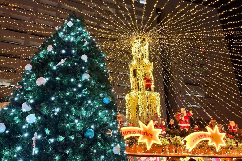 Decorated Christmas tree surrounded by holiday illuminations in at a Christmas Market in Fukuoka, Japan.