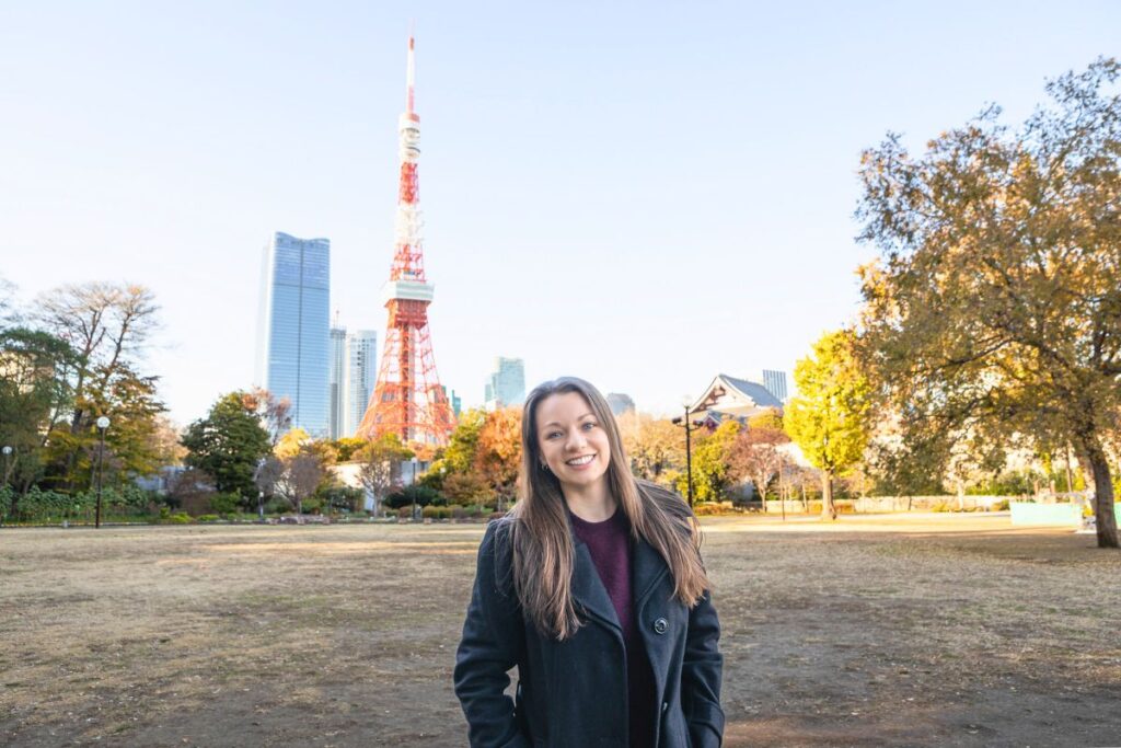 Krysti smiling at the camera with Tokyo Tower in the background.