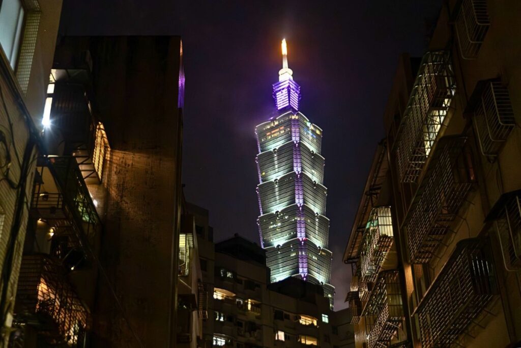 Taipei 101 all lit up at night.