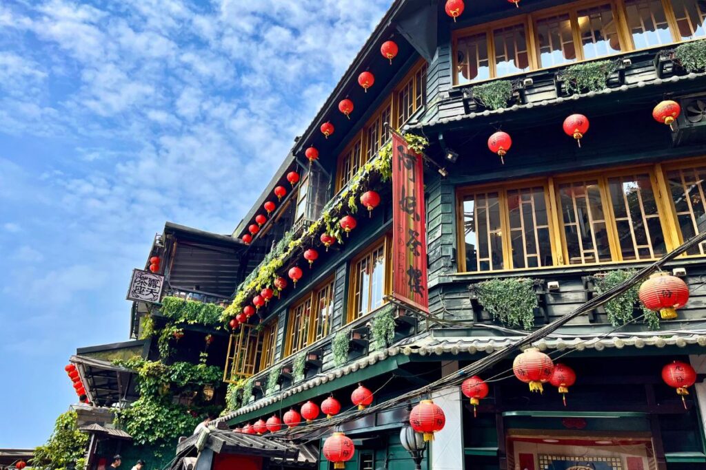 A Mei Teahouse A traditional tea house in Jiufen covered in red lanterns and greenery.