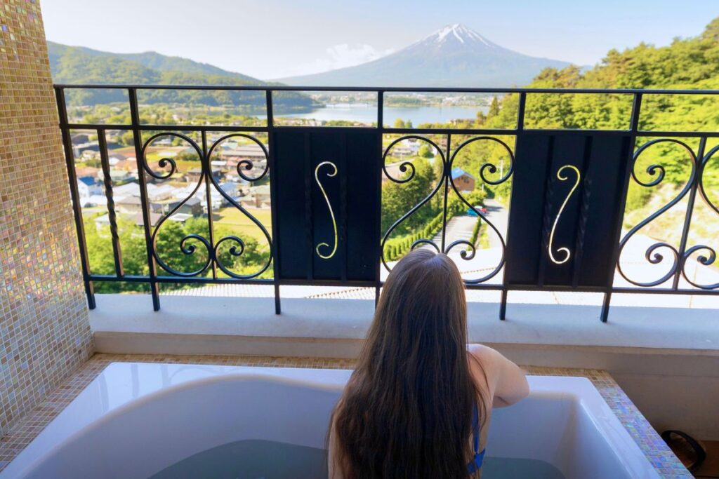Krysti on her balcony in the open-air bath looking out at Mt Fuji.