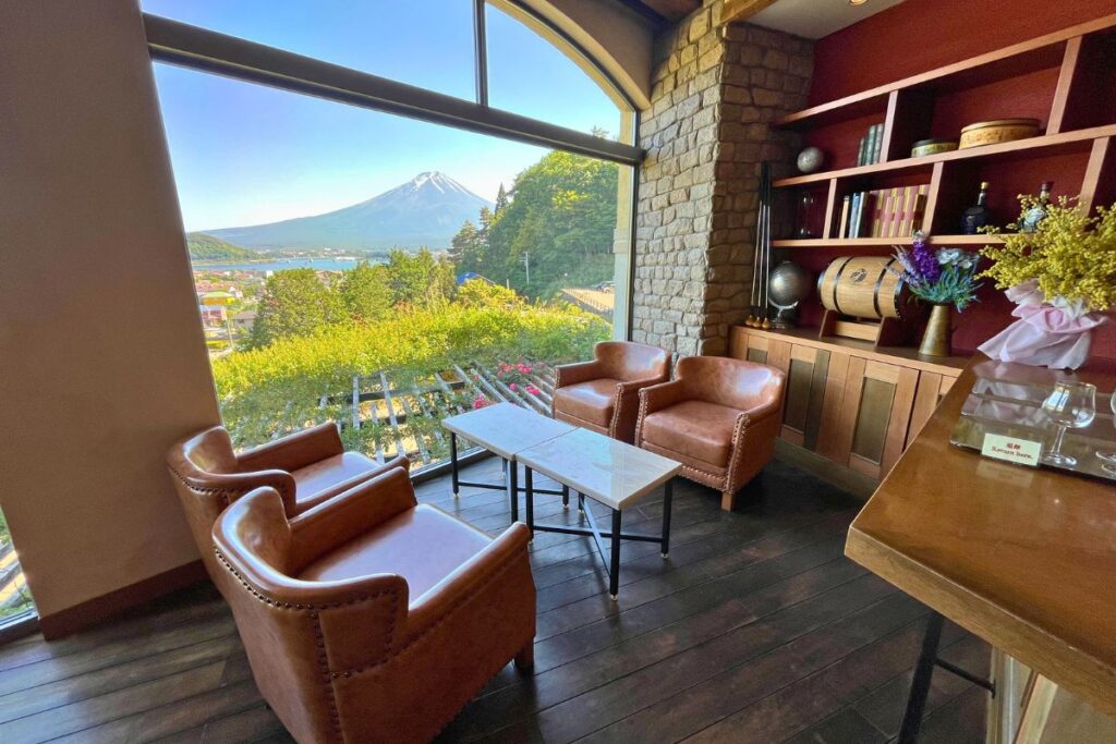 The lounge at La Vista Hotel with Mount Fuji visible through the roof-to-ceiling windows.