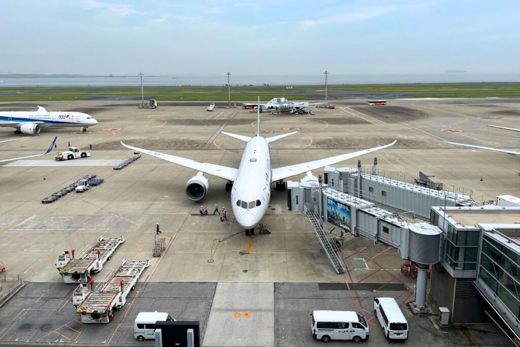 A plane parked at the gate at Haneda Airport in Tokyo.