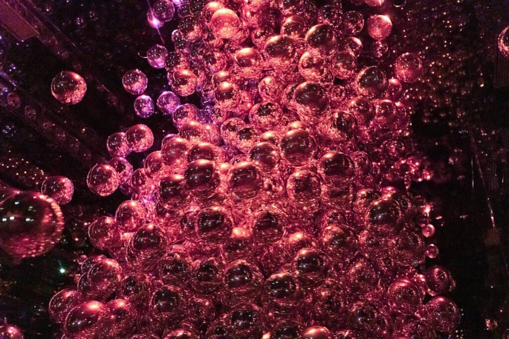 teamLab Kyoto A large mass of pink bubbles moving around in a tight circle.