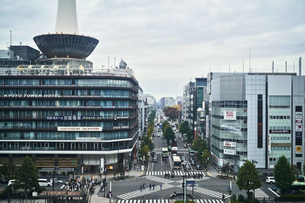 Building line a busy street near Kyoto Station