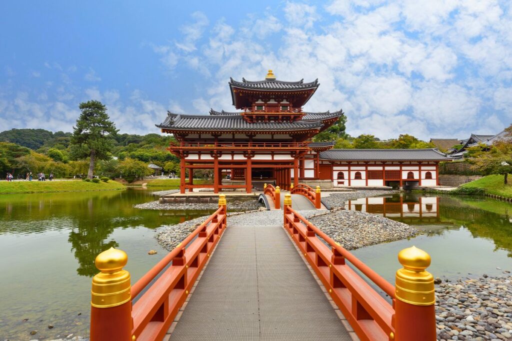 Red bridge leading to Byodo-in Temple in Uji.