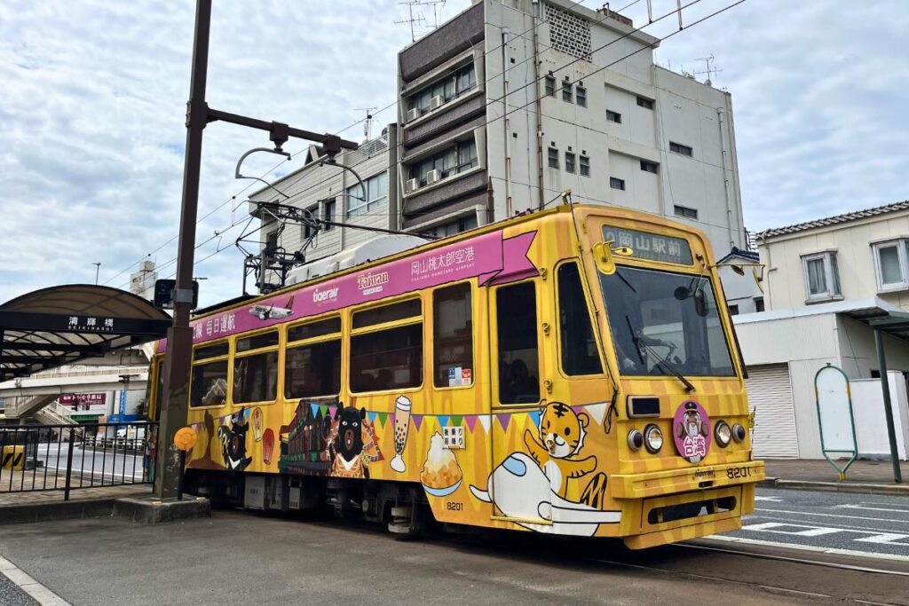 Yellow & pink tram in Japan.
