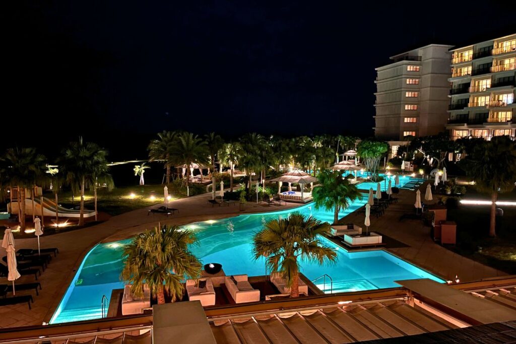 A nighttime view of the pool at ANA InterContinental Ishigaki all lit up.