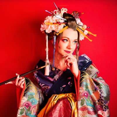 Krysti dressed in a traditional Japanese kimono looking beyond the camera
