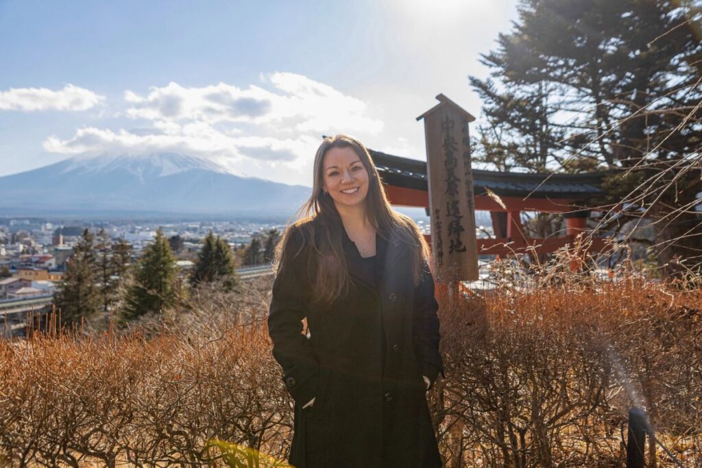 Krysti at Arakurayama Sengen Park with Mount Fuji in the background.